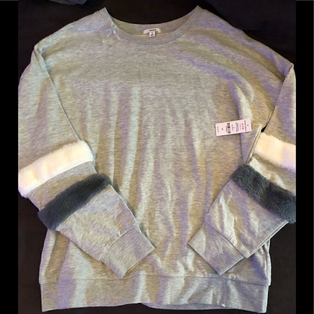 NWT Super soft gray and white sweatshirt with fur trim sleeves.